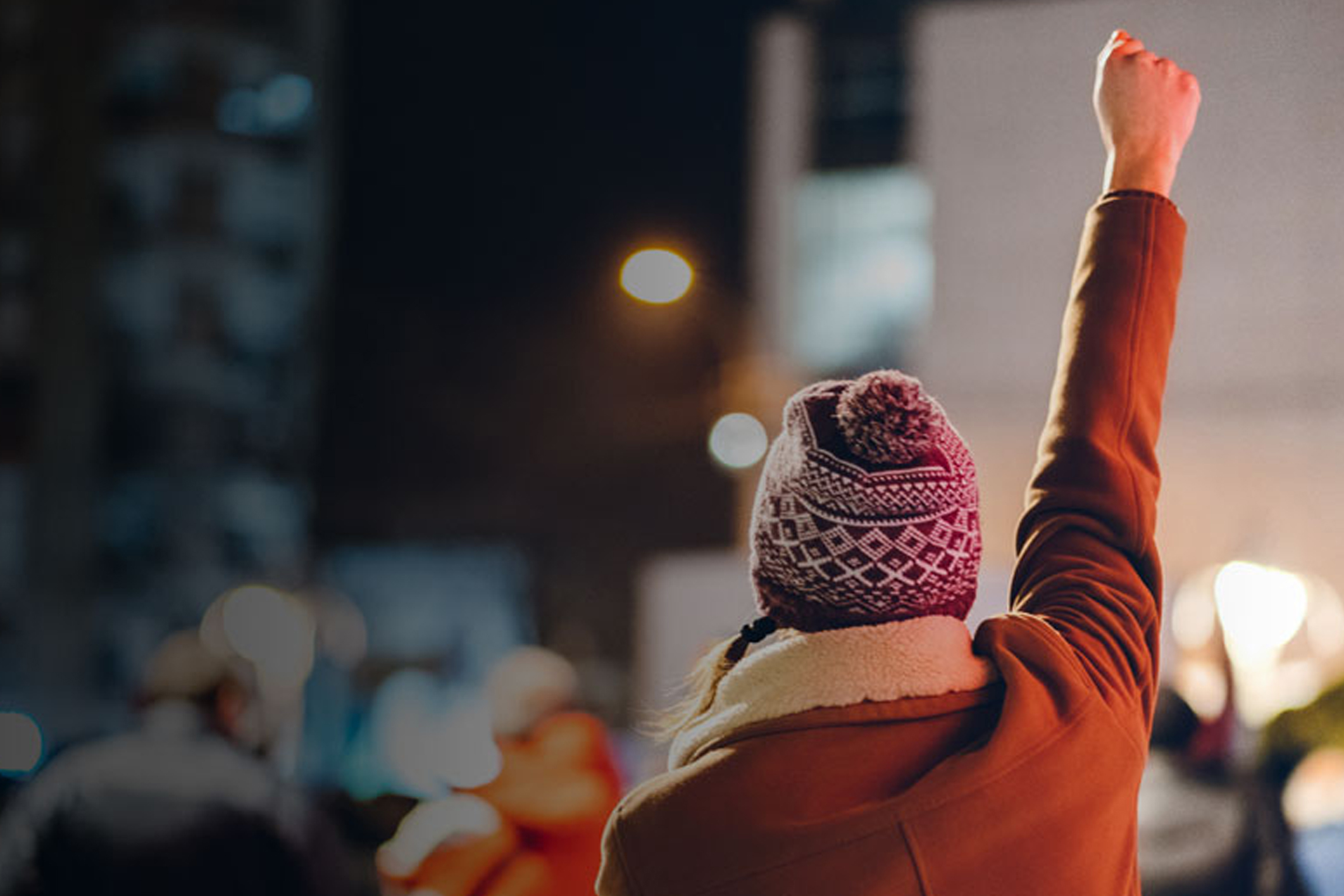 Woman raising her first in protest